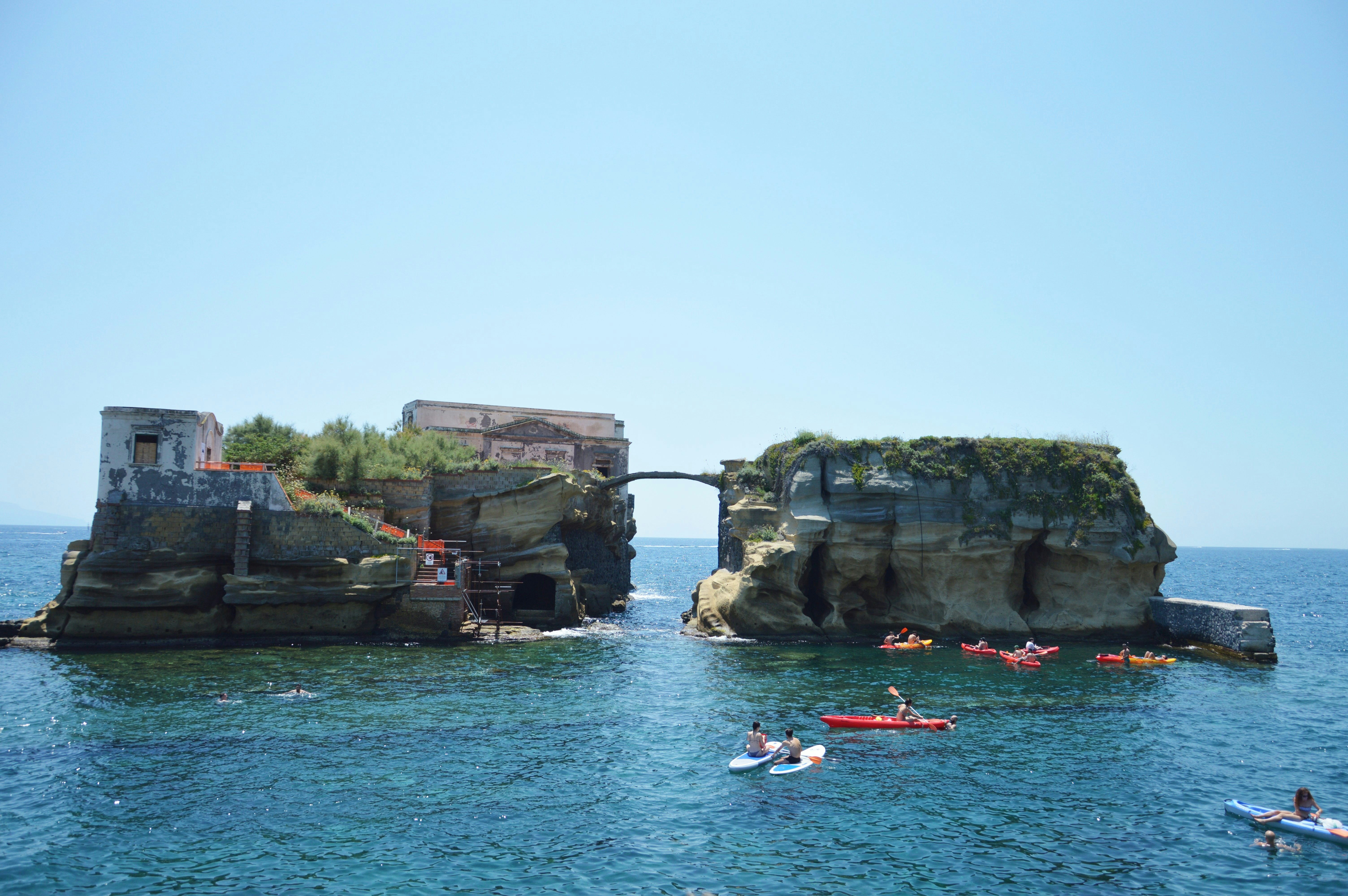 Sunbathers relax by the Gaiola Island, The Underwater Park of Gaiola, a protected marine area.Posillipo.Naples.Italy.