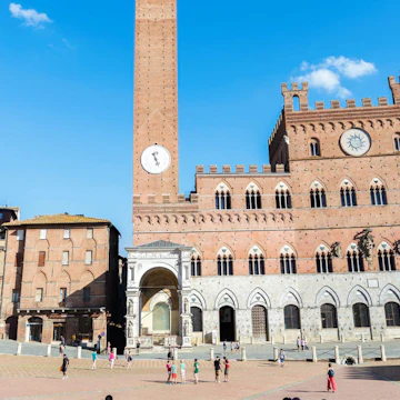 Piazza del Campo, Siena, Italy - stock photo
Pictured is the Torre del Mangia and town hall building which also houses the Museo Civico