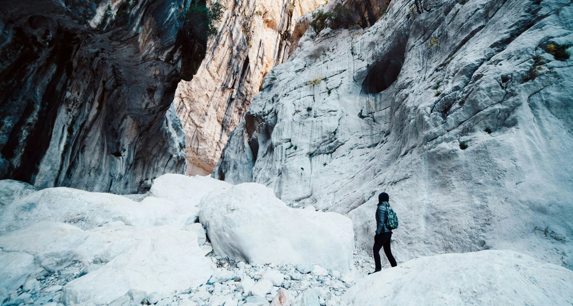 Woman hiking inside the deepest canyon in Europe - Activity and Health concept - Gola Su Gorroppu.