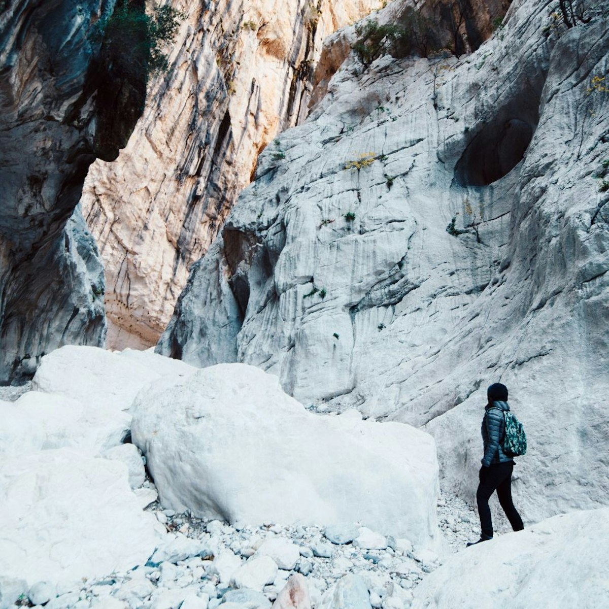 Woman hiking inside the deepest canyon in Europe - Activity and Health concept - Gola Su Gorroppu.