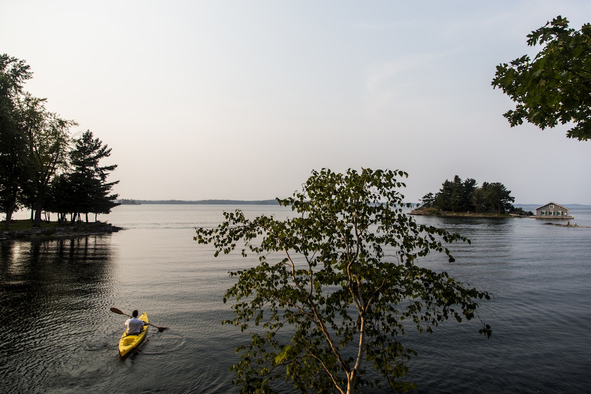 A Man Kayaking On Saint Lawrence River In The Thousand Islands Of Upstate New York