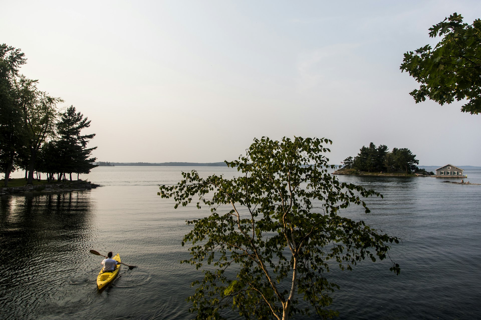 A man kayaks along the St. Lawrence River in the 1000 islands of upstate New York.
