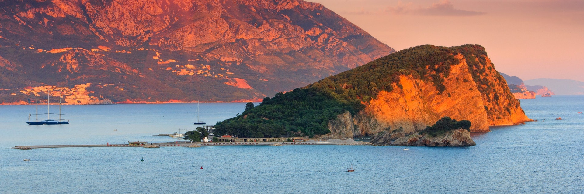 Panoramic landscape of coast Budva riviera:Sveti Nikola island and mountains at sunset. Dramatic evening sky. Balkans, Adriatic sea, Europe.
Landscape of coast Budva riviera:Sveti Nikola island at sunset. - stock photo