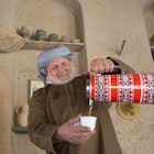 Nizwa, Oman, December 15th, 2016: Omani man serving arabic coffee; Shutterstock ID 540695065; your: Tasmin Waby; gl: 65050; netsuite: Online Editorial; full: Demand Project