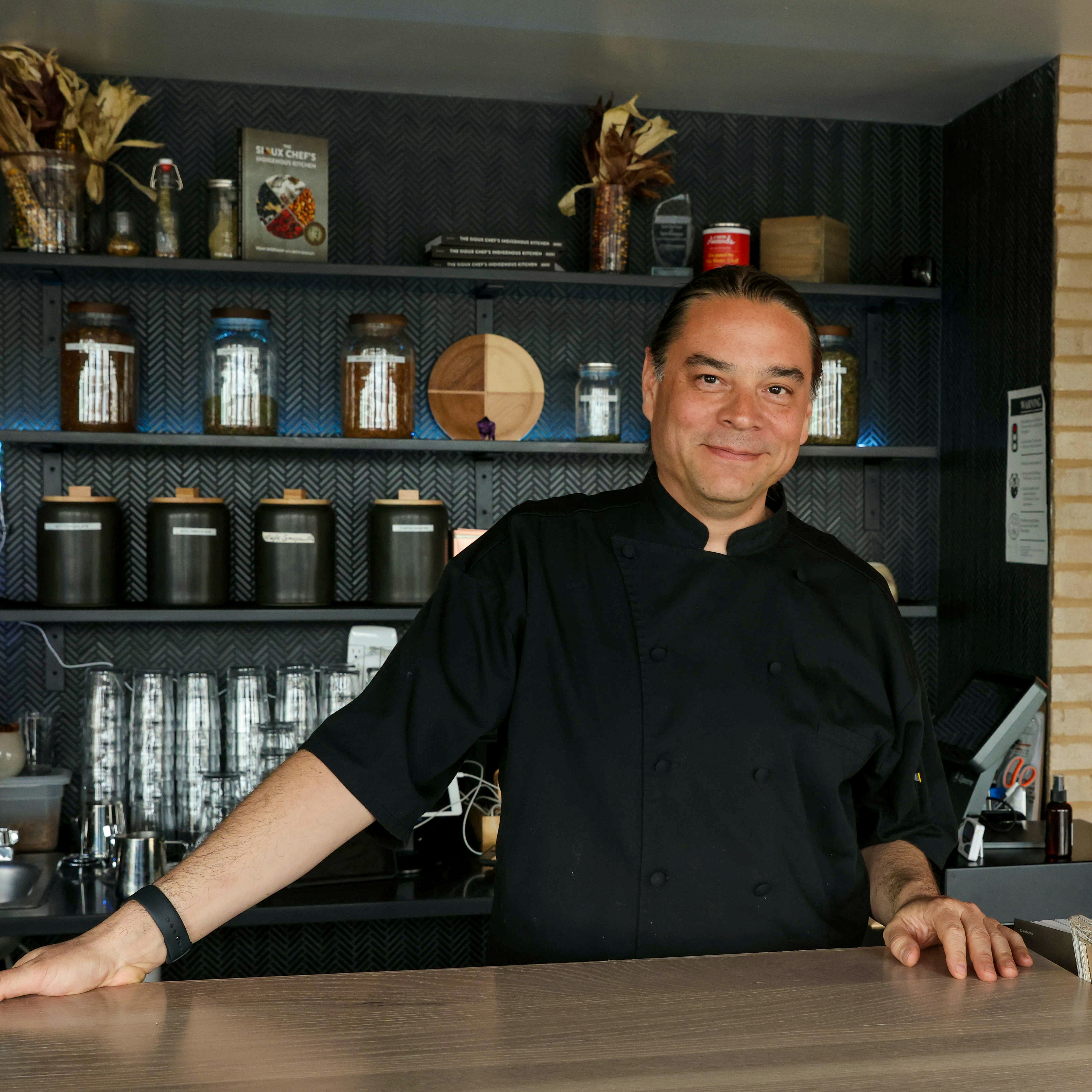 Chef and co-owner, Sean Sherman at front desk of  Owamni.