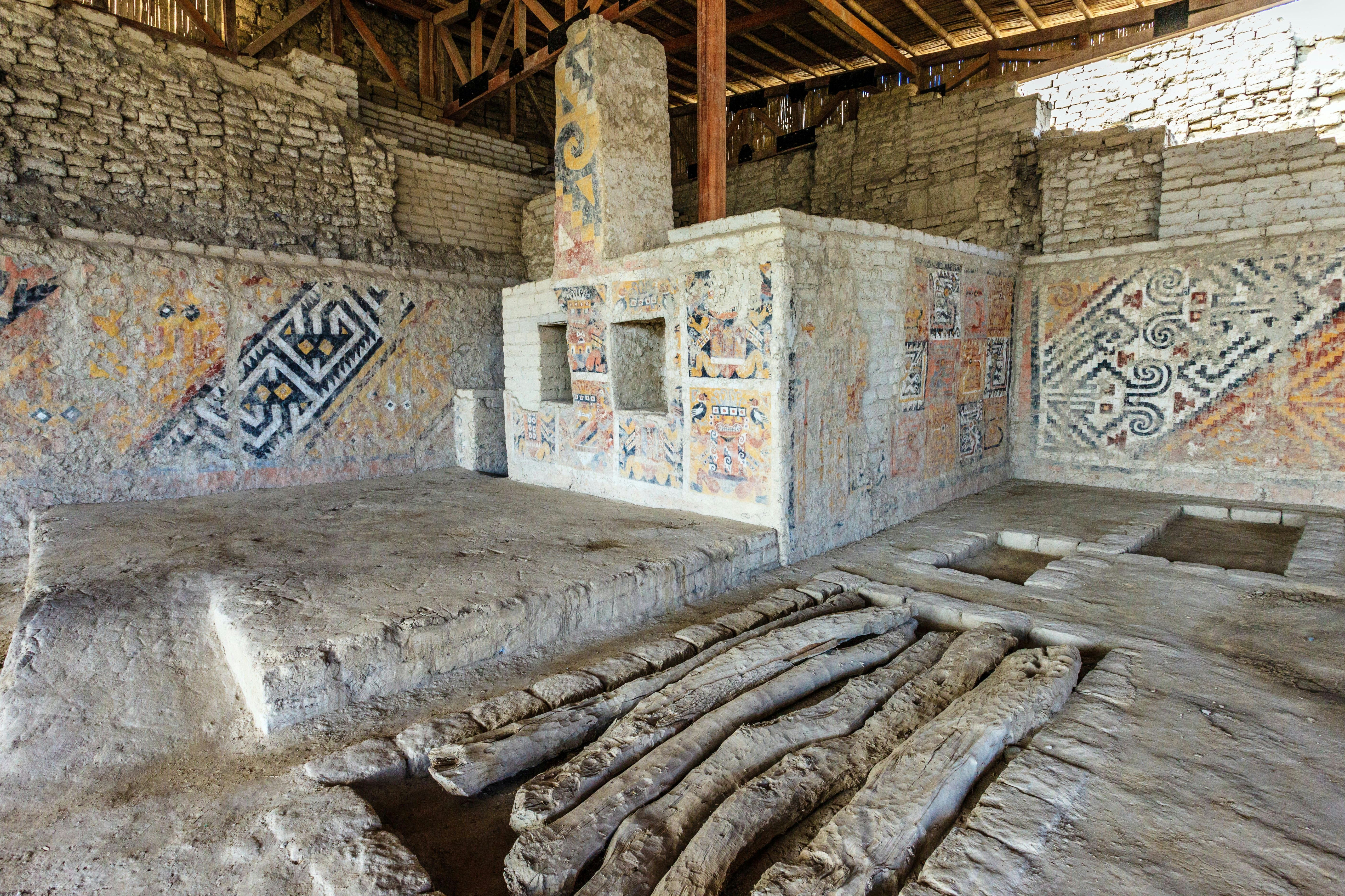 El Brujo Archaeological Complex, just north of Trujillo, La Libertad Province, Peru, is an ancient archaeological site of the Moche Civilisation in the Chicama Valley. Building archaeology unveils seven phases of construction spanning the early and middle phases of Moche era. Huaca Cao Viejo is famous for its polychrome reliefs and mural paintings, and the discovery of the Señora de Cao. The 25 year old woman buried here was believed to be a 3rd century AD female ruler of the Moche state, and her tomb was full of gold and other previous artifacts. The murals at the complex also depict the ritual human sacrifice that took place here regularly: teams of men would engage in ritual battles and the losing team would willingly be sacrificed to the gods to ensure fertility and peace in the community. Murals show the naked warriors (with fully erect penis) being marched to the sacrificial platform to be decapitated and blood to be collected for the gods.