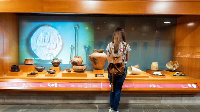 Galdar, Spain - March 2, 2019: Woman admiring the Interior of museum and Archaeological park, Cueva Pintada, in Galdar Gran Canaria, Spain . ; 
Cueva Pintada Museum & Archaeological Park

Shutterstock ID 1462682909; your: Bridget Brown; gl: 65050; netsuite: Online Editorial; full: POI Image Update