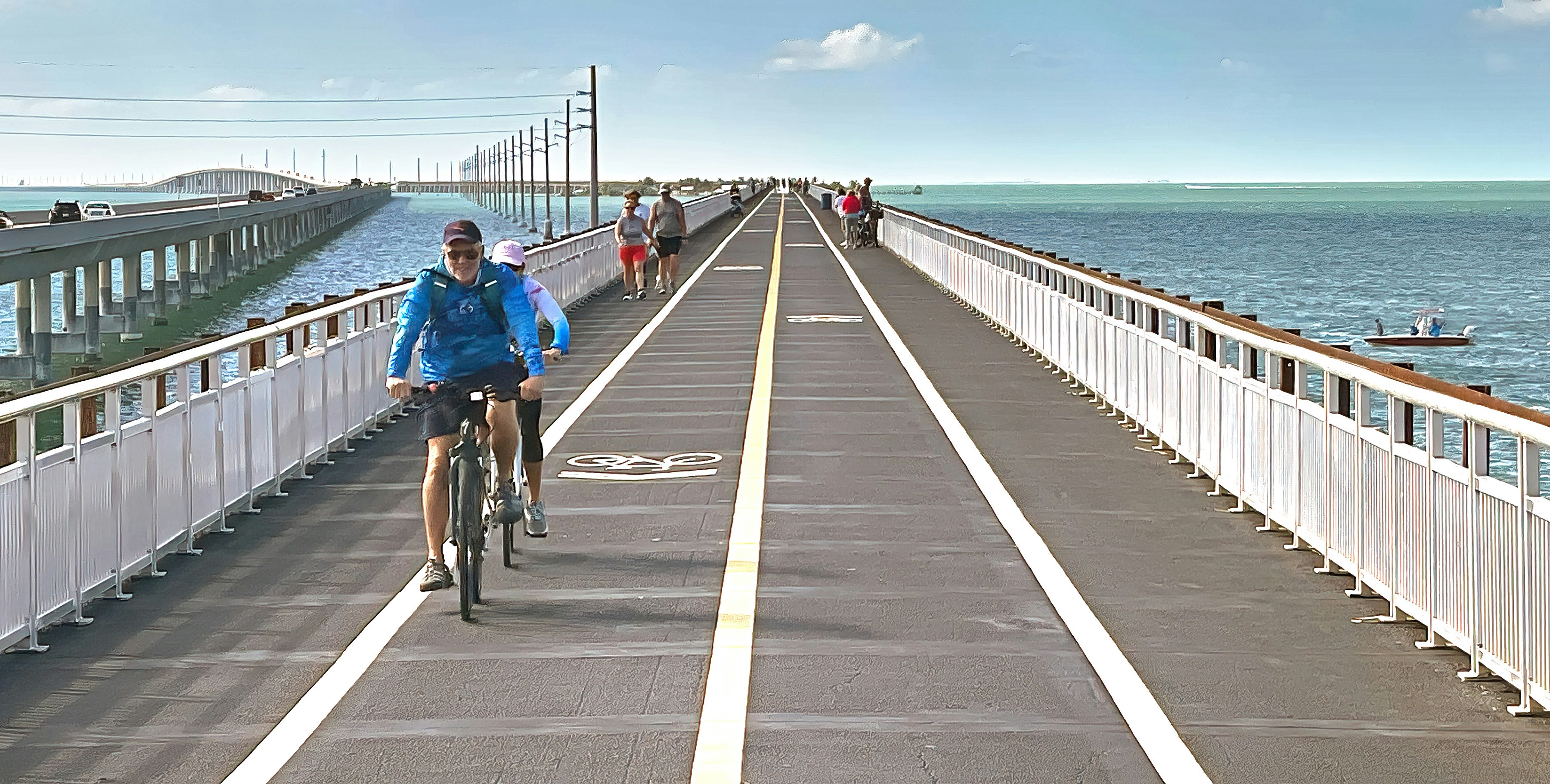Visitors and residents bicycle and walk on the Florida Keys’ Old Seven Mile Bridge Wednesday, Jan. 12, 2022, in Marathon, Fla. The 110-year-old span formally opened Wednesday after a ceremony marked the completion of a four-year, $44 million restoration project. The old bridge originally was part of Henry Flagler’s Florida Keys Over-Sea Railroad that was completed in 1912. It later became the centerpiece of the Florida Keys Overseas Highway, but was replaced in 1982 with a new span. The old bridge is closed to vehicles but open to pedestrians and bicycles. FOR EDITORIAL USE ONLY (Andy Newman/Florida Keys News Bureau/HO)
