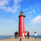 People looking at the north pier lighthouse in Kenosha, Wisconsin