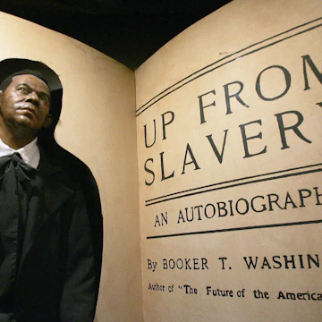 Baltimore, UNITED STATES: A wax figure of Booker T. Washington stands is seen on exhibit at the the National Great Blacks in History Musuem in Baltimore, Maryland, 13 February 2006. The exhibit puts a face on the stolen history of Blacks in America. AFP PHOTO/Jim WATSON (Photo credit should read JIM WATSON/AFP via Getty Images)