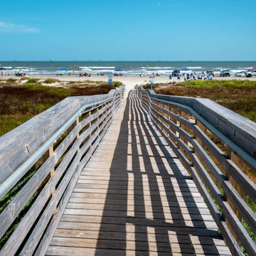 View of a boardwalk leading to East Beach Galveston Island Texas.