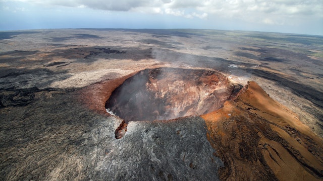 The smoking crater of the volcano Mauna Loa on Big Island, Hawaiian archipelago, in Volcanoes National Park, after the eruption of lava in the summer of 2018, from the air