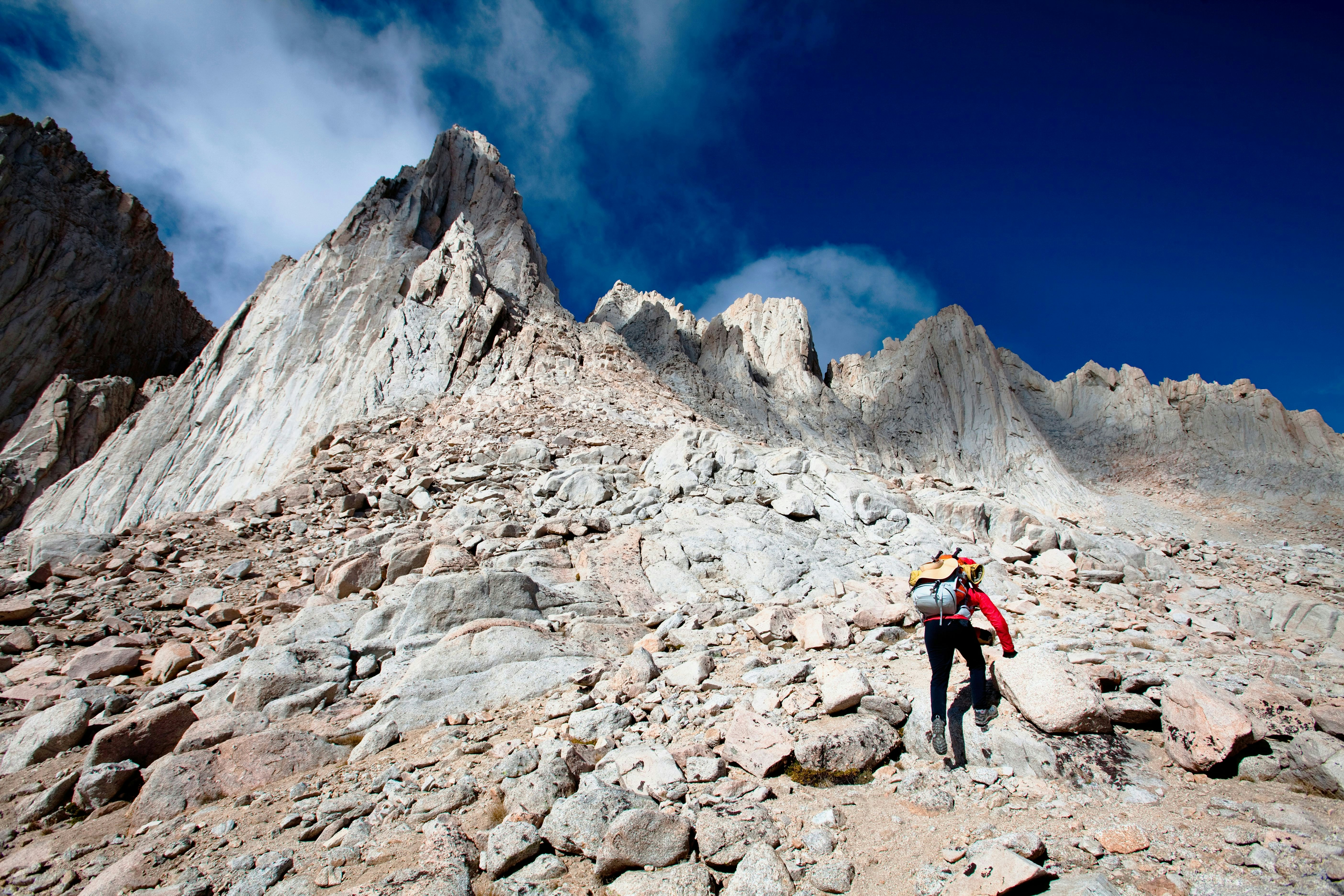A female hiker scrambles up the mountaineer’s route of Mount Whitney, California on October 3, 2009. Mount Whitney is the highest mountain in the continental United States and stands 14,494 feet tall. Mt Whitney
