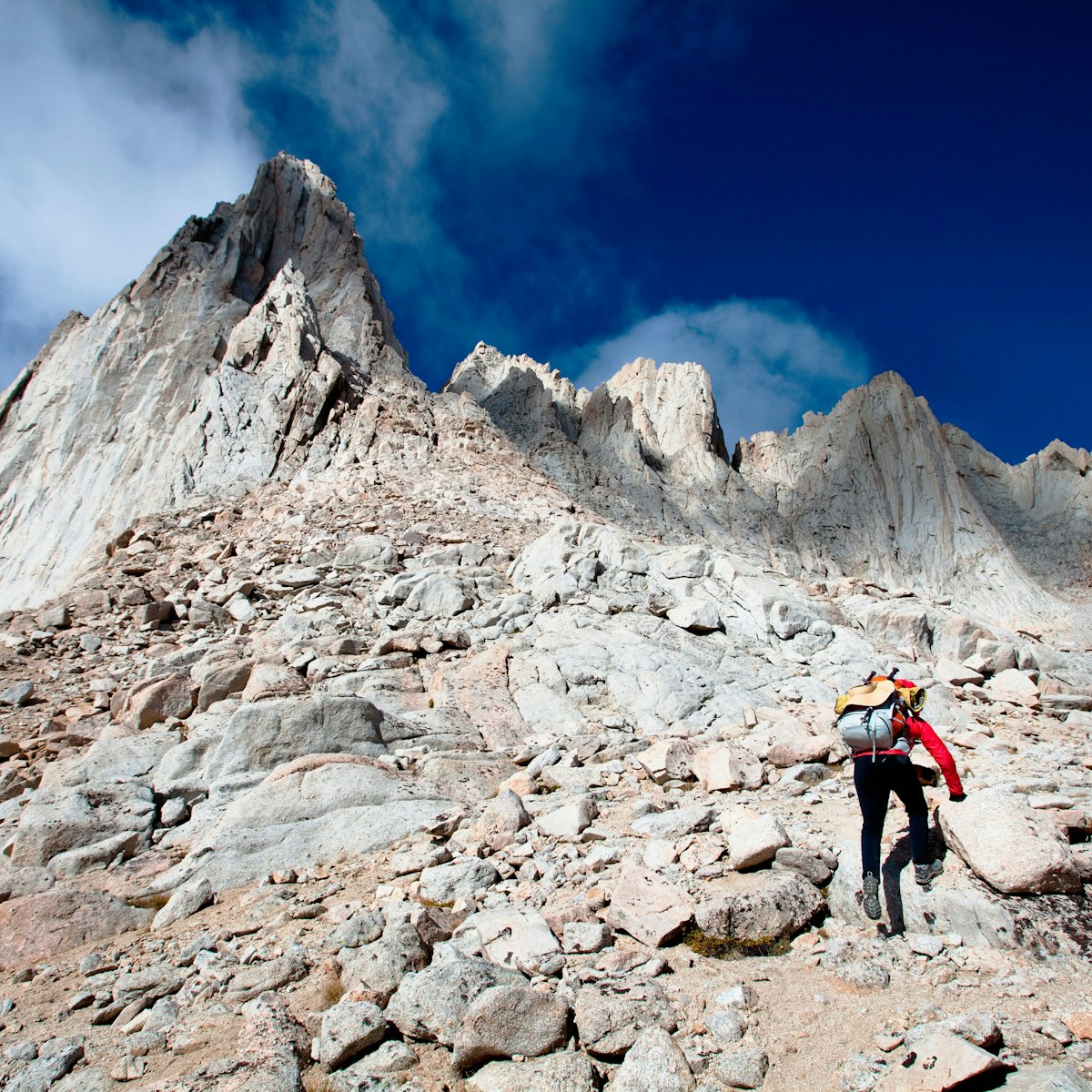 A female hiker scrambles up the mountaineer’s route of Mount Whitney, California on October 3, 2009. Mount Whitney is the highest mountain in the continental United States and stands 14,494 feet tall. Mt Whitney

