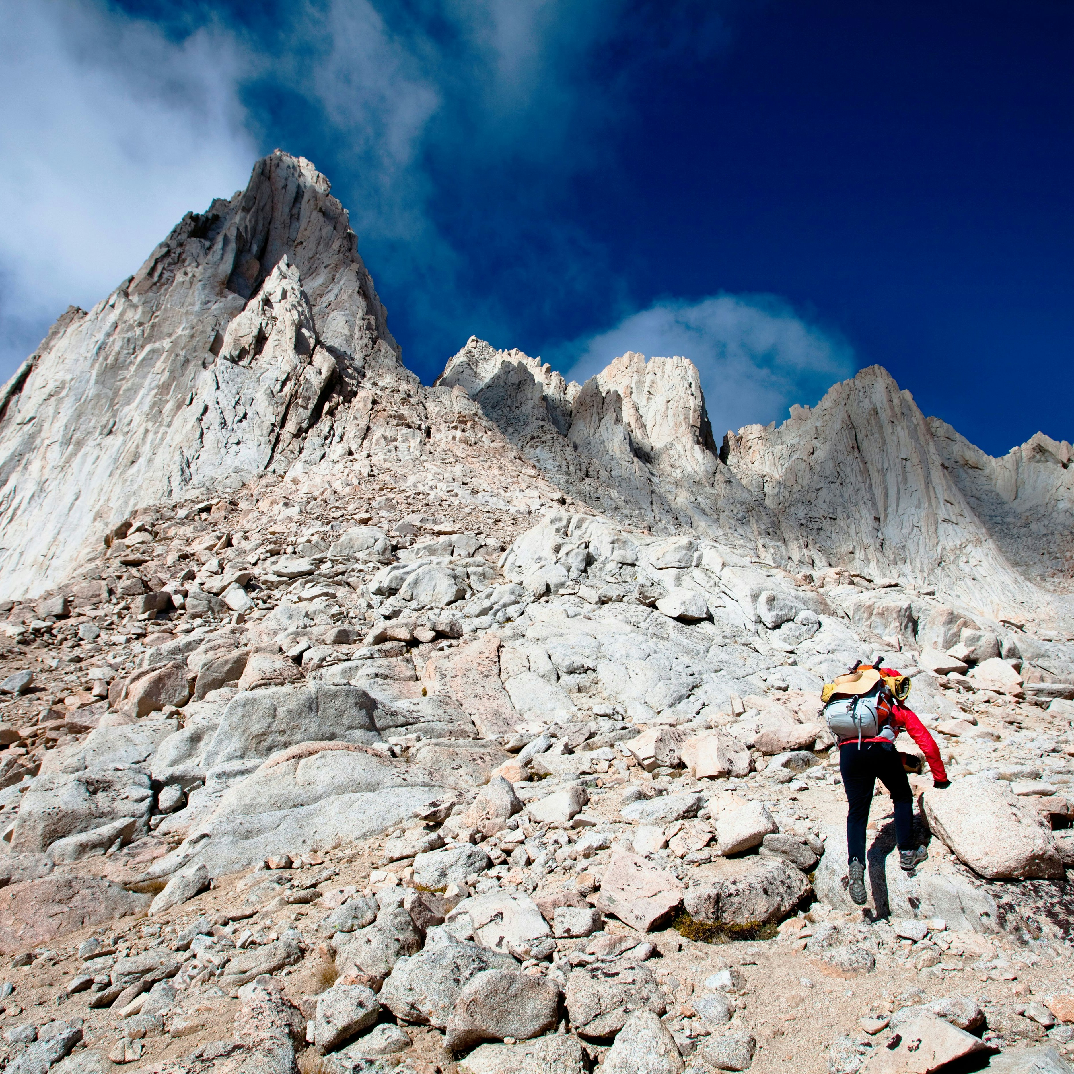 A female hiker scrambles up the mountaineer’s route of Mount Whitney, California on October 3, 2009. Mount Whitney is the highest mountain in the continental United States and stands 14,494 feet tall. Mt Whitney