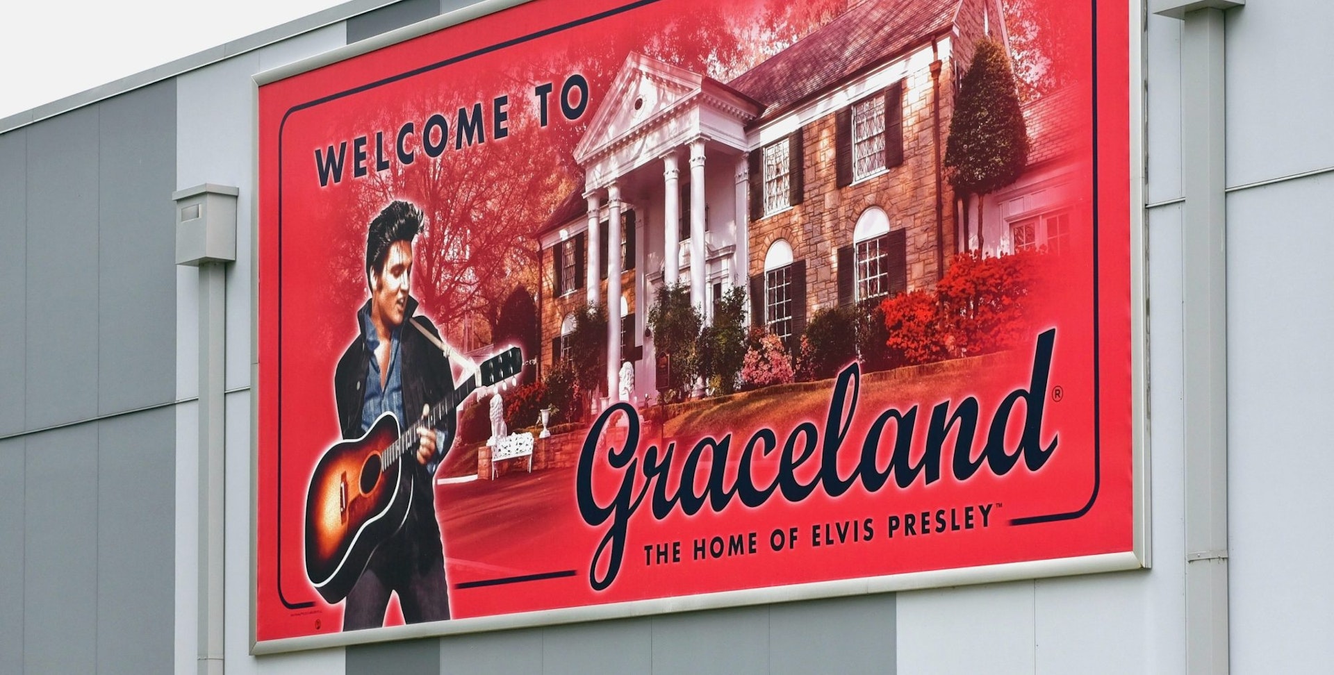 rance to the Graceland complex featuring sign of Elvis