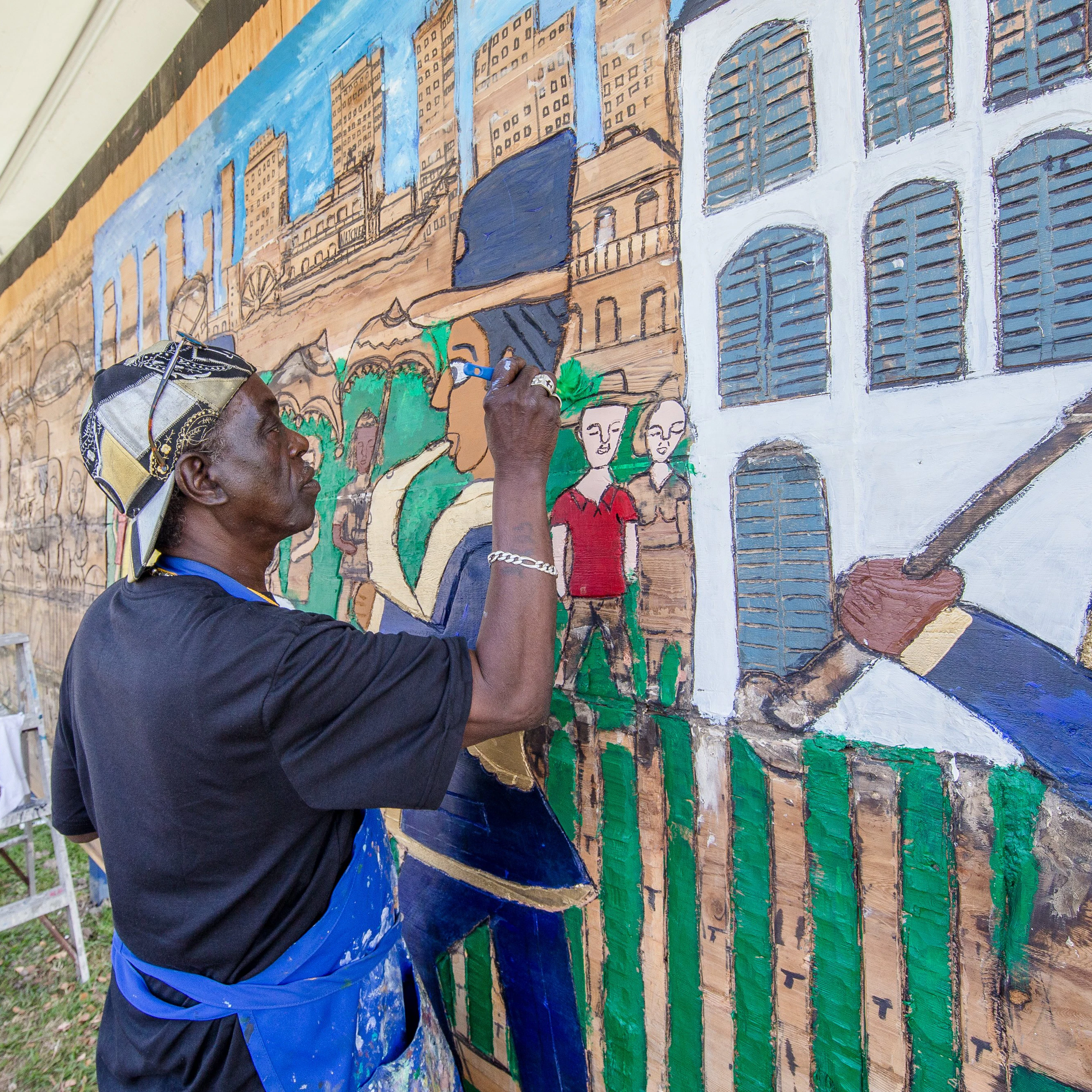 NEW ORLEANS, LA - APRIL 28: Artist Charles Gillam works on a wood carving at the New Orleans Jazz & Heritage Festival at the Fair Grounds Race Course on April 28, 2018 in New Orleans, Louisiana. (Photo by Josh Brasted/WireImage)