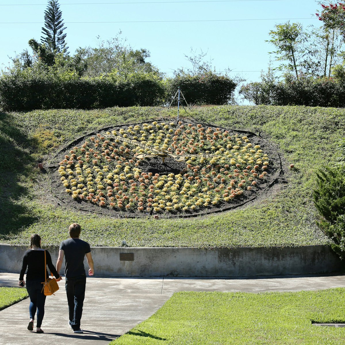 ORLANDO, FL, USA - OCTOBER 29: Visitors admire the larger than life living floral clock at Harry P. Leu Gardens, a destination garden with over 40 diverse plant collections as seen on October 29, 2017