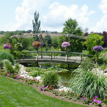 Woman walking in the gardens at Thanksgiving Point.