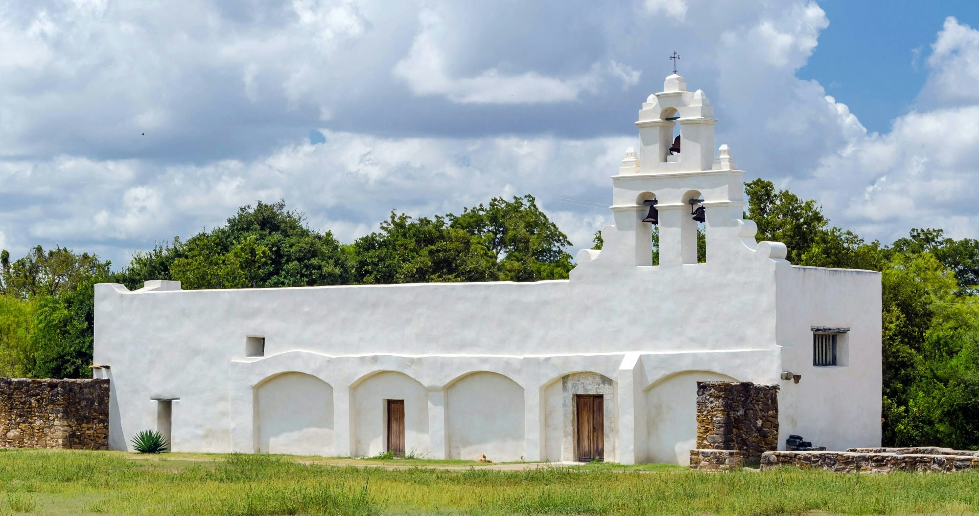 This landmark image depicts Mission San Juan Capistrano in San Antonio, Texas. This UNESCO World Heritage Site was established in 1731 by Spanish colonist along the banks of the San Antonio River.
