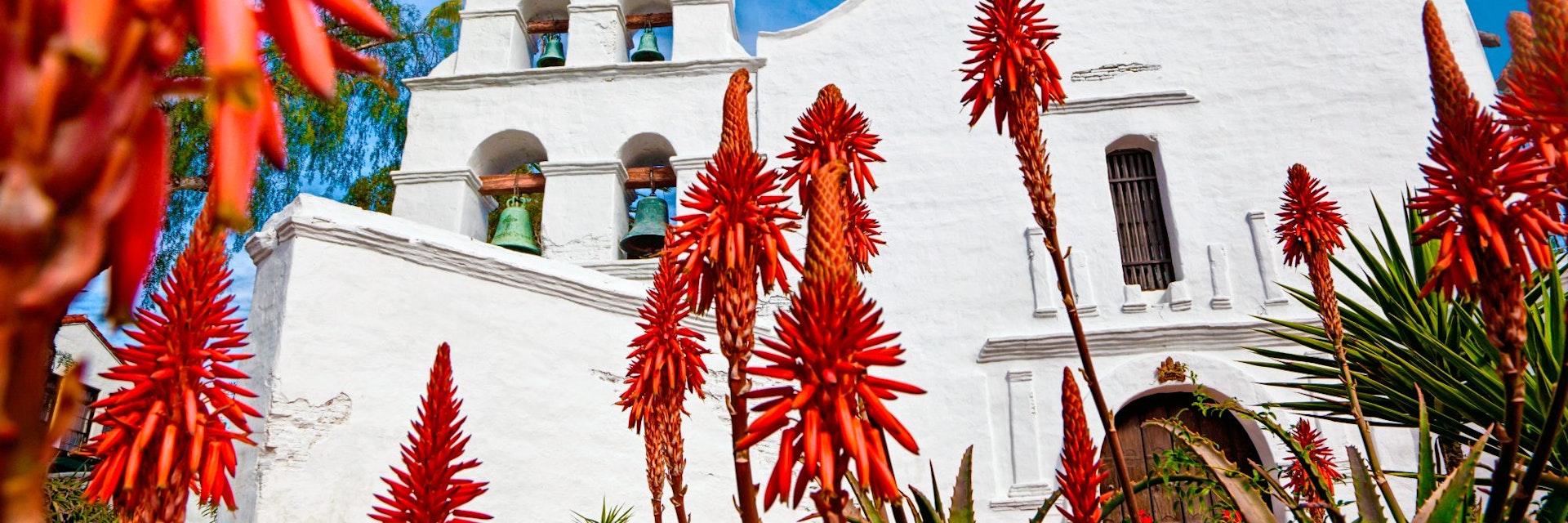 Mission Basilica San Diego de Alcala. - stock photo
California's first mission. Aloe plants blooming in foreground.