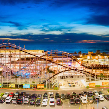 Editorial March 28, 2019 - Belmont Park roller coaster in Pacific Beach, San Diego California. Aerial drone photo taken late evening.; Shutterstock ID 1401262877; your: Bridget Brown; gl: 65050; netsuite: Online Editorial; full: POI Image Update