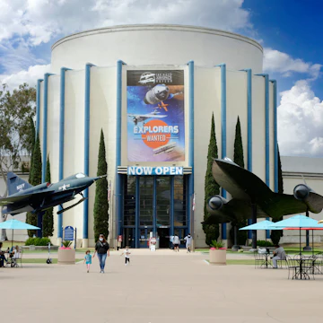 Outside the San Diego Air and Space Museum in Balboa Park with a Lockheed A12 Oxcart and Convair YF2Y-1 on either side of the entrance