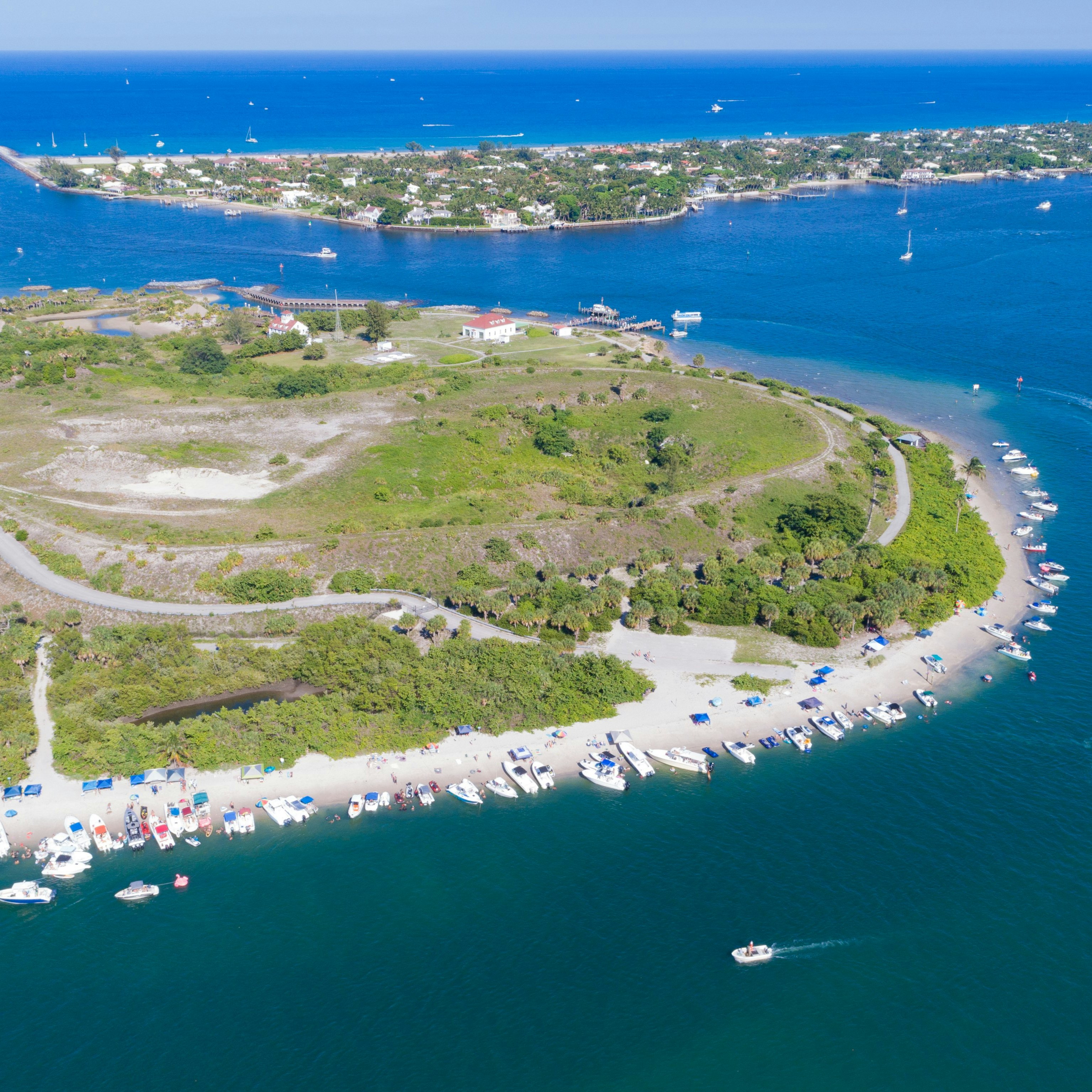 Aerial view of Peanut Island in Riviera Beach, Florida on memorial day weekend. Clear skies and blue water with plenty of boaters