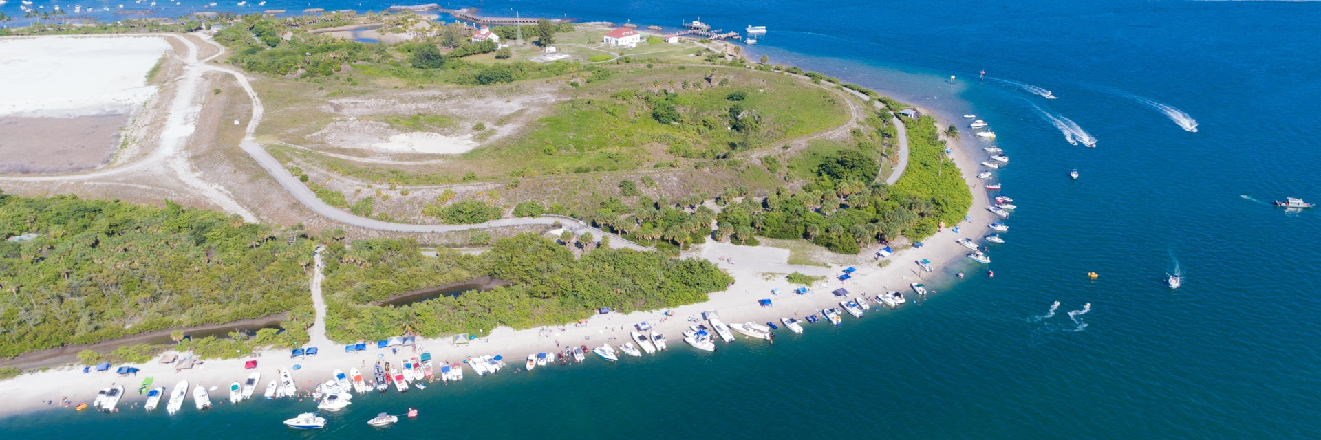Aerial view of Peanut Island in Riviera Beach, Florida on memorial day weekend. Clear skies and blue water with plenty of boaters