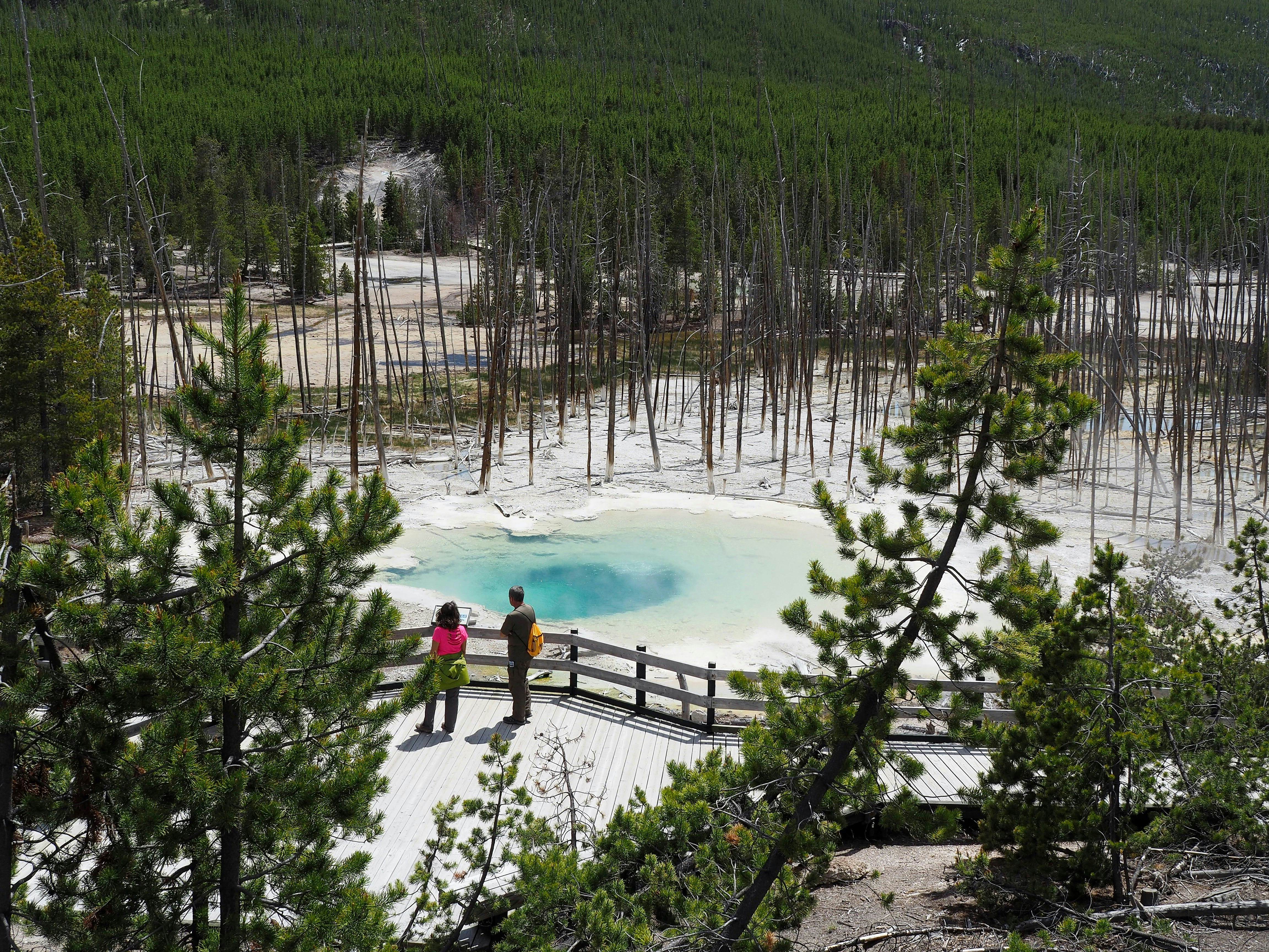 Two hikers at Cistern Spring, Norris Geyser Basin, Yellowstone National Park, Wyoming.
Two Hikers at Cistern Spring, Yellowstone National Park - stock photo
