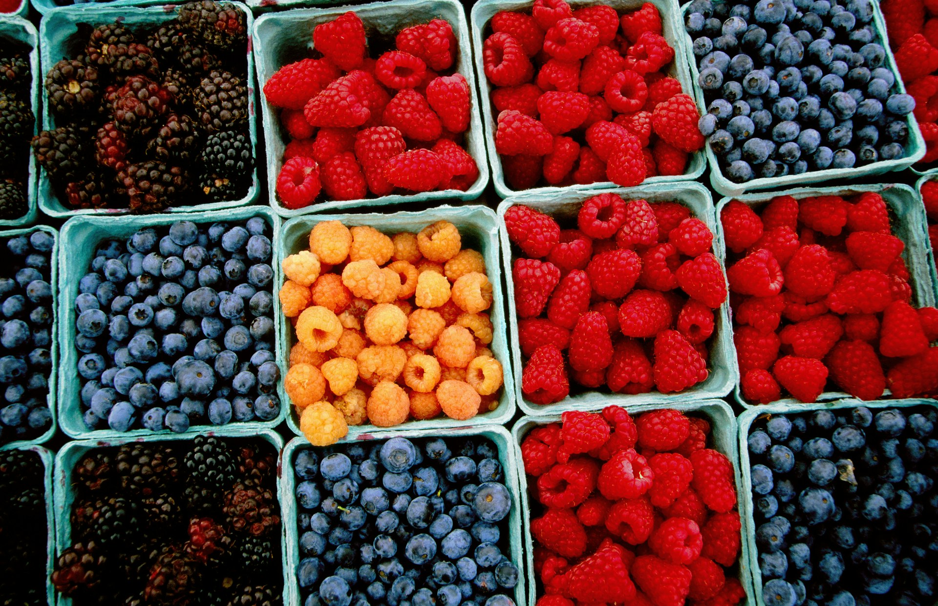 Raspberry, blueberry and blackberry punnets at Farmers Market.