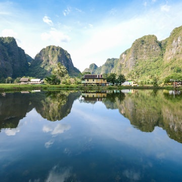 Beautiful limestones and water reflections in Rammang Rammang park near Makassar, South Sulawesi, Indonesia