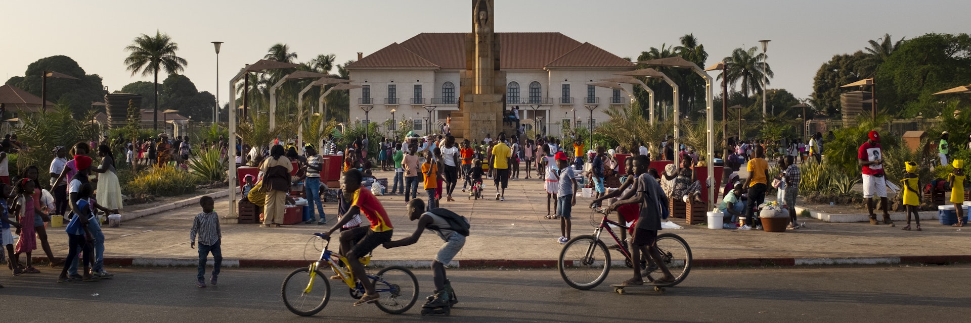 Bissau, Republic of Guinea-Bissau - February 11, 2018: Street scene in the city of Bissau with people at the Praca dos Herois Nacionais, in Guinea-Bissau, West Africa