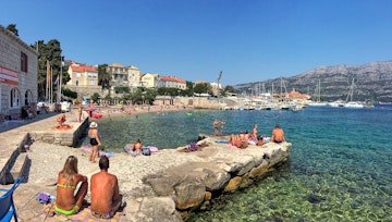 Banje Beach is pebble / shingle beach, situated in Borak area in Korcula Town. This is the oldest beach in the town, very busy in the summertime, crowded with tourists as well as locals.