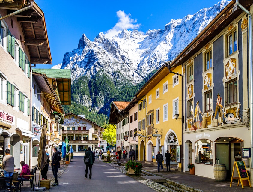 Mittenwald, Germany - September 27: historic buildings and tourists at the famous old town of Mittenwald on September 27, 2020