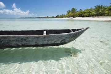 Wooden canoe in a idyllic remote beach in the northern of Madagascar