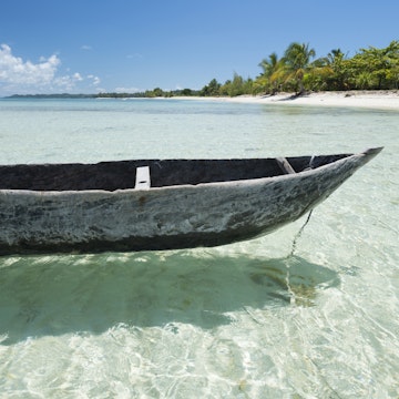 Wooden canoe in a idyllic remote beach in the northern of Madagascar