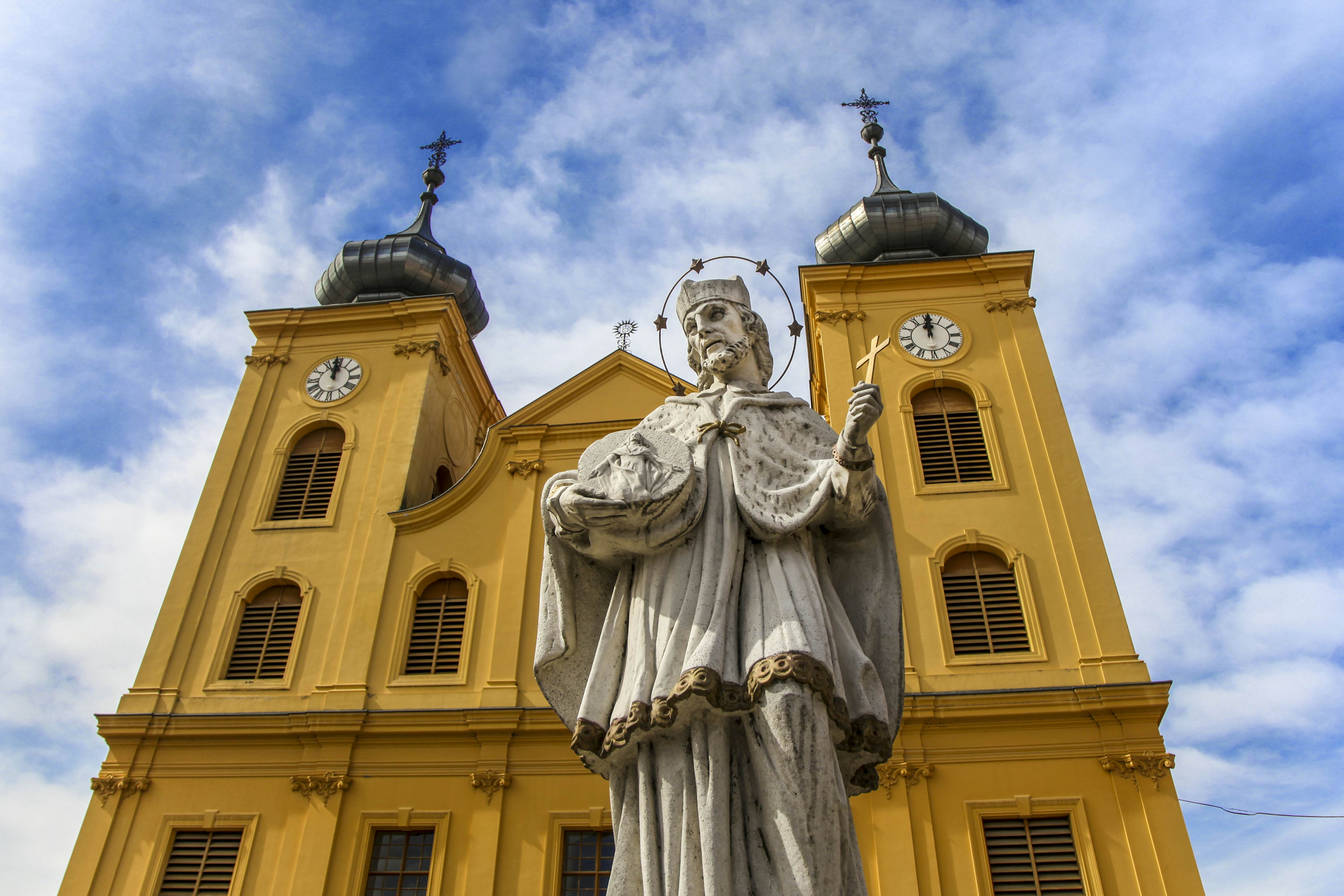 Monument and St. Michael church in old town Osijek, Croatia.