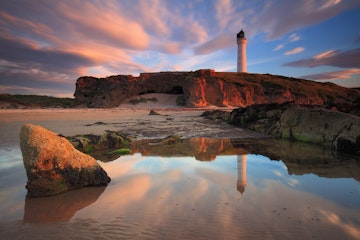 Amazing sunset over the Lossiemouth lighthouse (Scotland, UK)