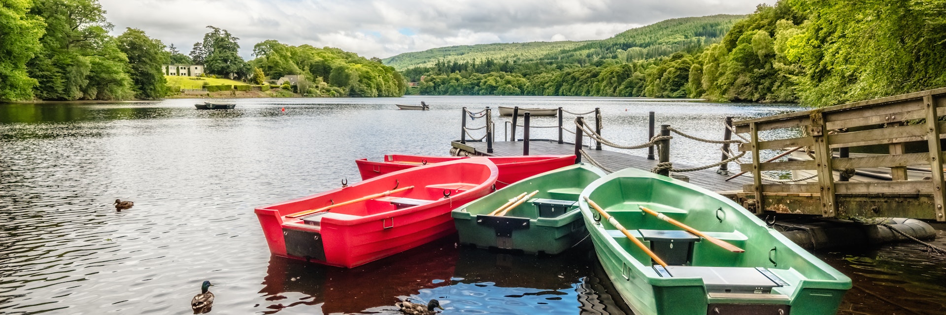 Rowing boats on Loch Faskally at Pitlochry, Scotland.