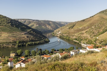 View over the River Douro and the Douro Valley and the riverfront town of Pinhão, Portugal. The Douro Valley is one of the most prominent wine regions in Portugal