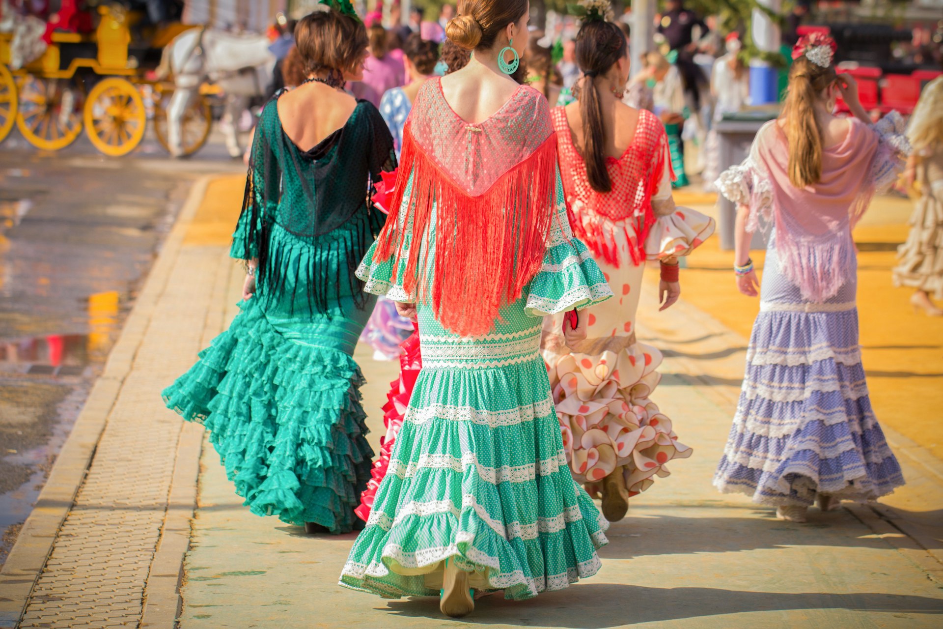 Women wearing traditional costumes at the Seville Fair (Feria de abril de Sevilla).