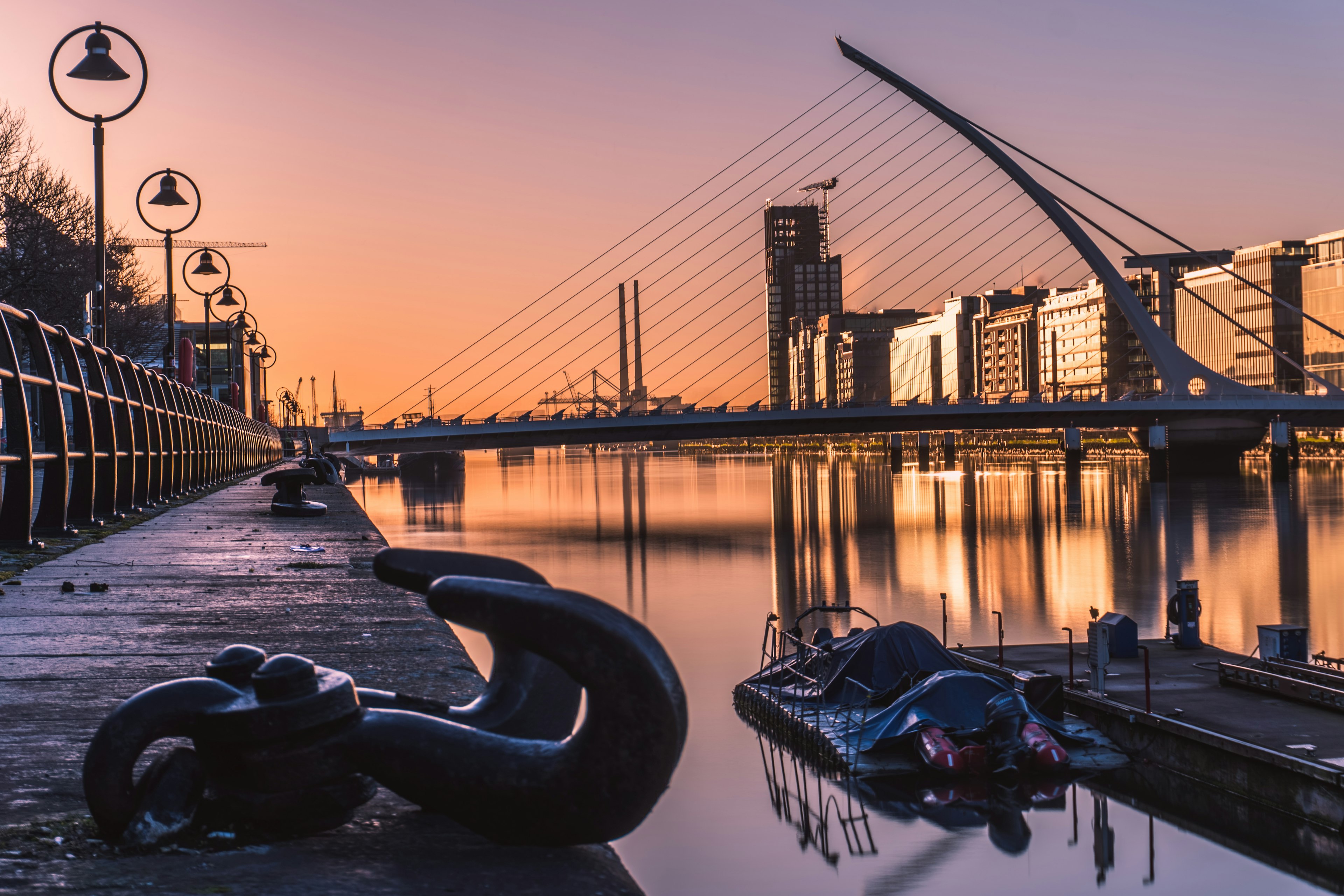 A bridge over a river at sunrise