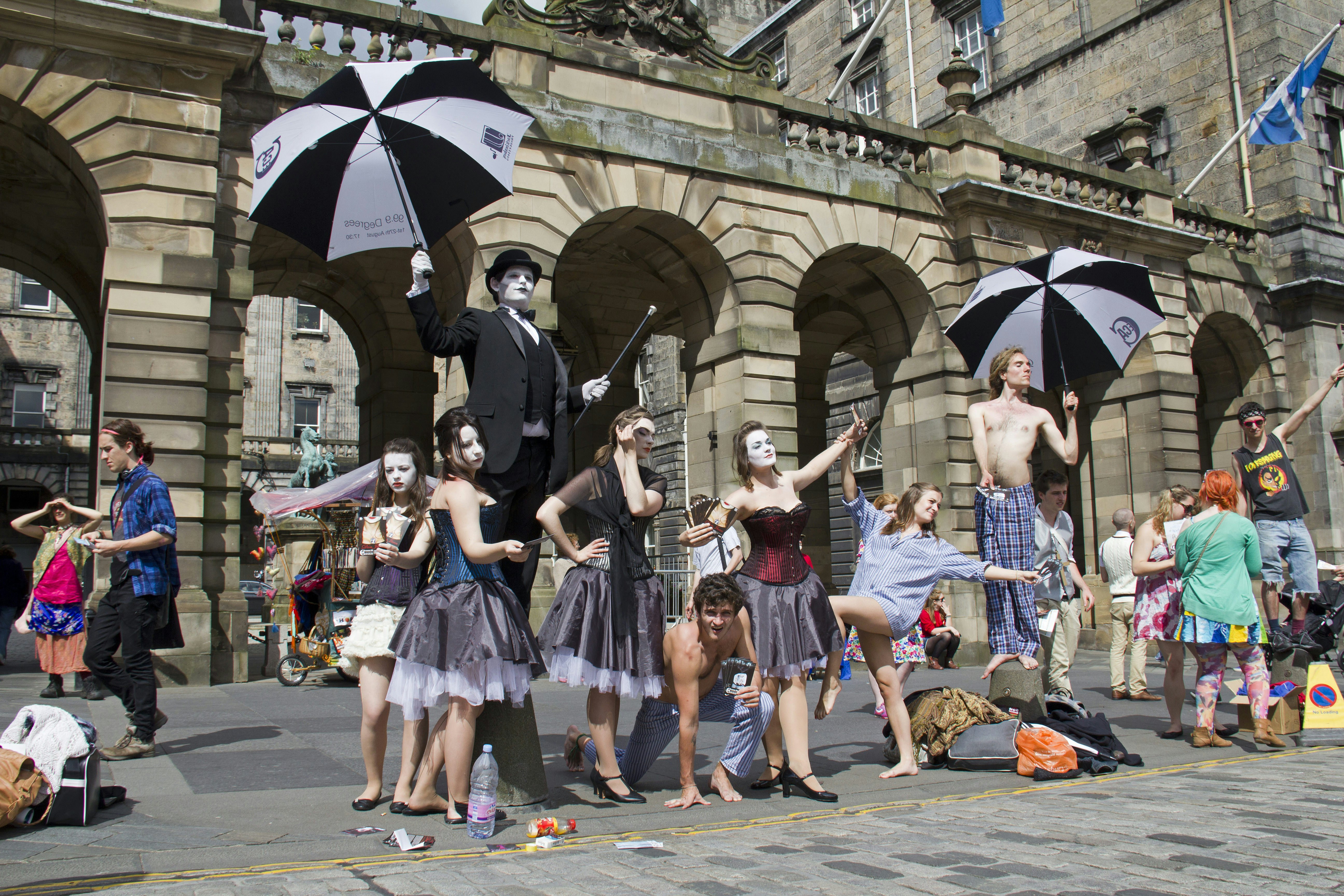 Performers stage a streetside show at the Edinburgh Fringe Festival