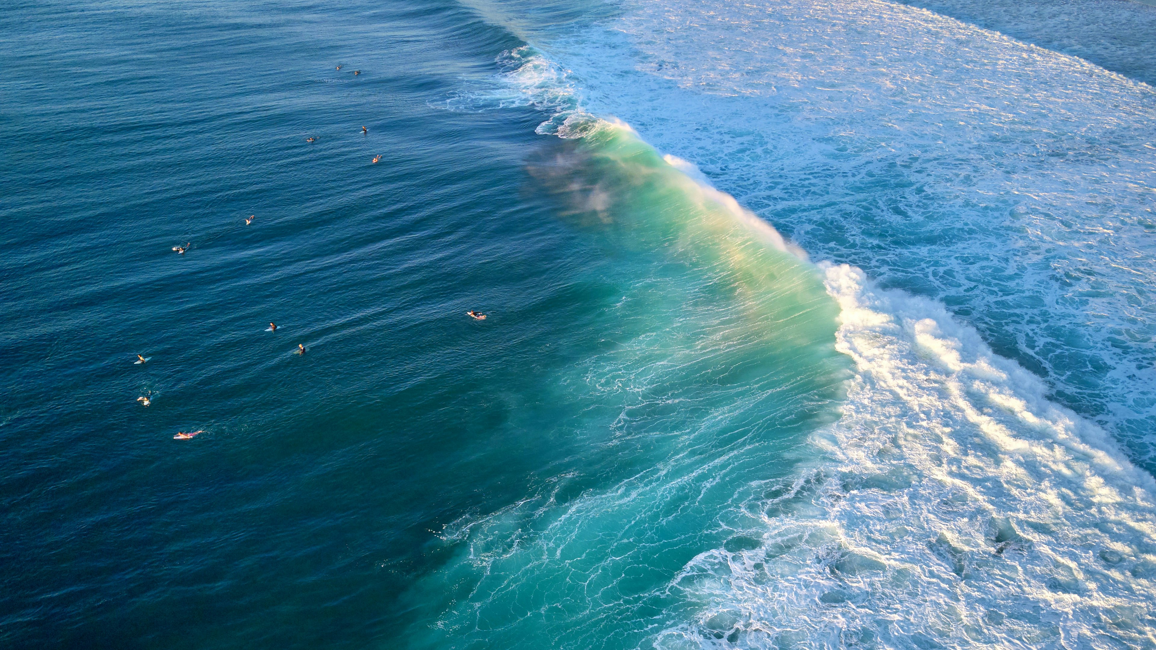 An aerial view of surfers at the internationally famous break G-land, on the Blambangan Peninsula