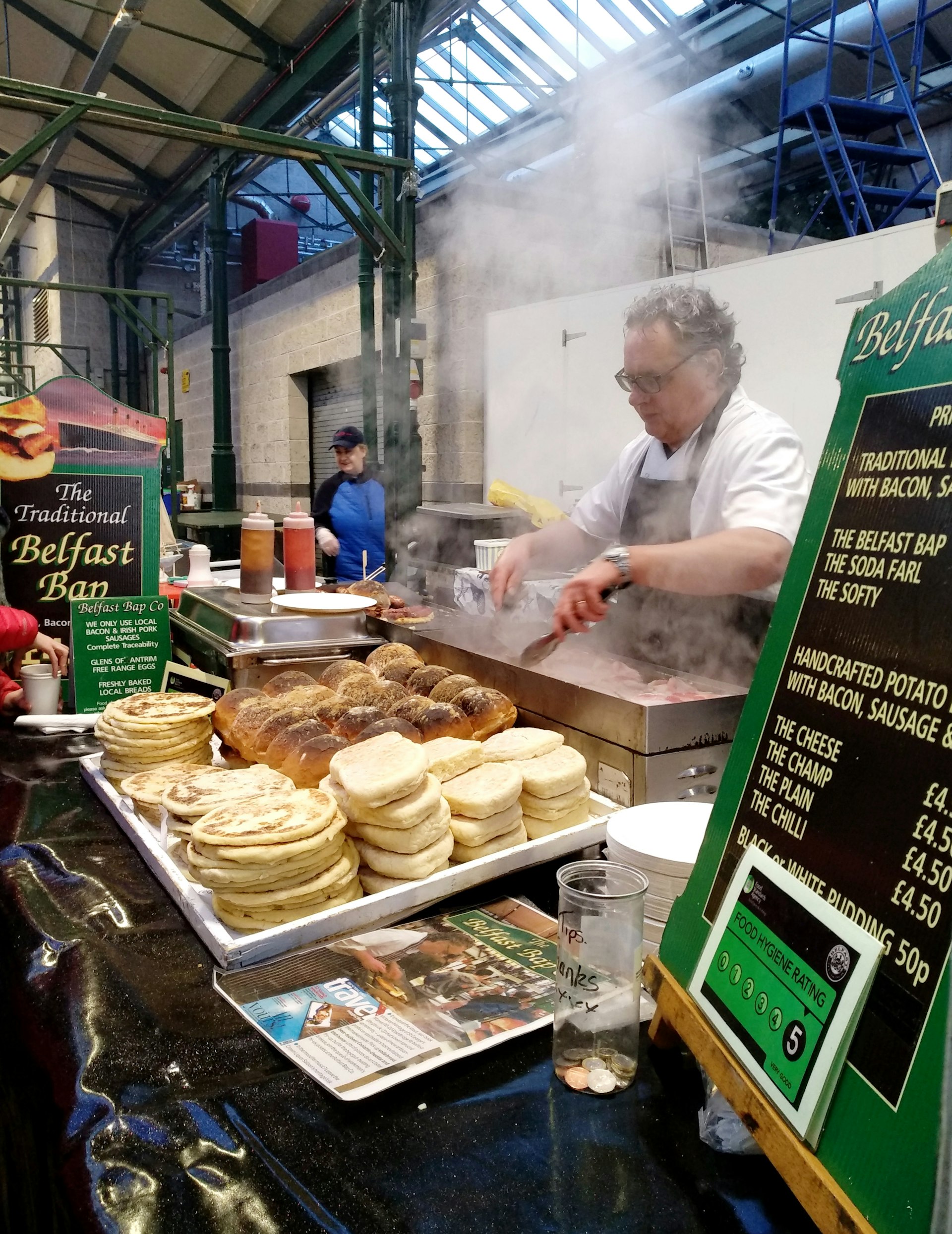 The owner of Belfast Bap Co, cooking his traditional signature Belfast Baps at a St.George Market food stall