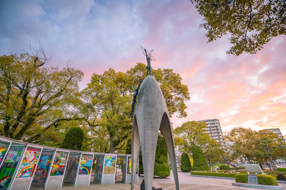 MARCH 24, 2019: The Children's Peace Monument with a statue of a girl holding a folded paper crane, at the Hiroshima Peace Memorial Park.