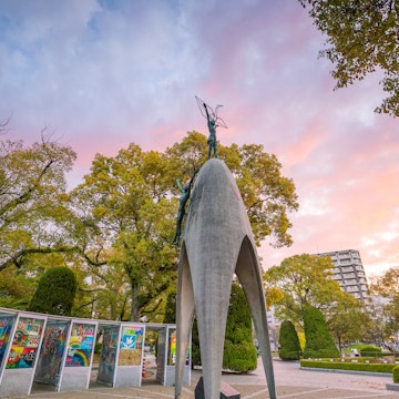 MARCH 24, 2019: The Children's Peace Monument with a statue of a girl holding a folded paper crane, at the Hiroshima Peace Memorial Park.