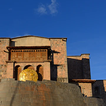 The temple of the sun or "Qorikancha" in Cusco during Inti Raymi (hence the solar disc), Peru.