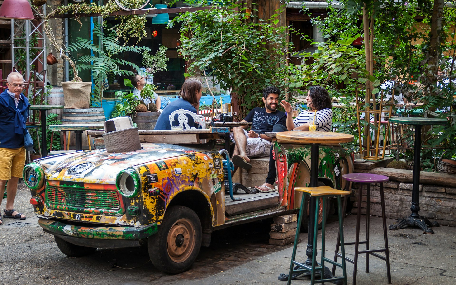 Visitors enjoy a drink at Szimpla Kert, a well-known Ruin-bar in Budapest 